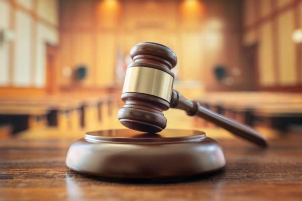 Judges gavel in court room legal trial and law background