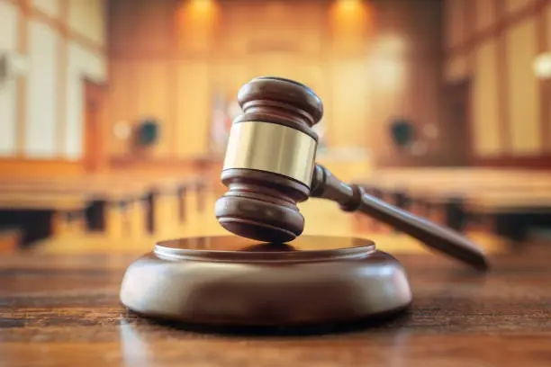 Judges gavel in court room legal trial and law background